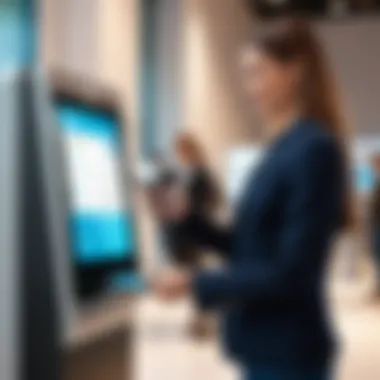 Employees engaging with a touchscreen kiosk for visitor registration.